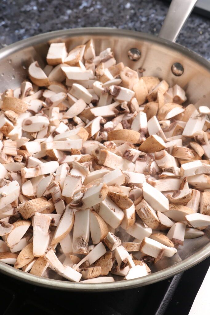 mushrooms sautéing in a pan