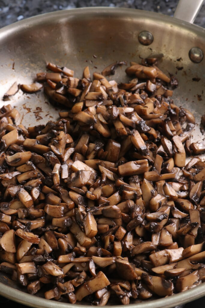 mushrooms sautéing in a pan