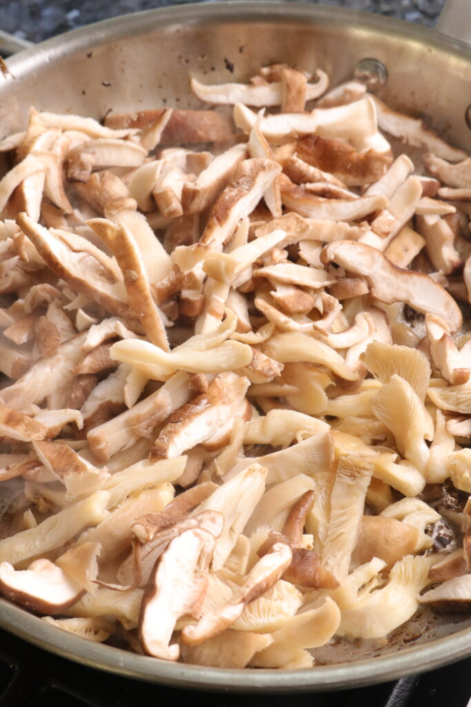 mushrooms sautéing in a pan