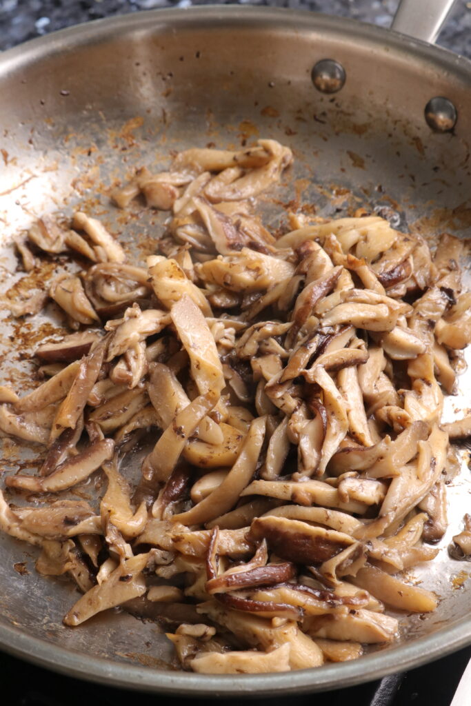 mushrooms sautéing in a pan