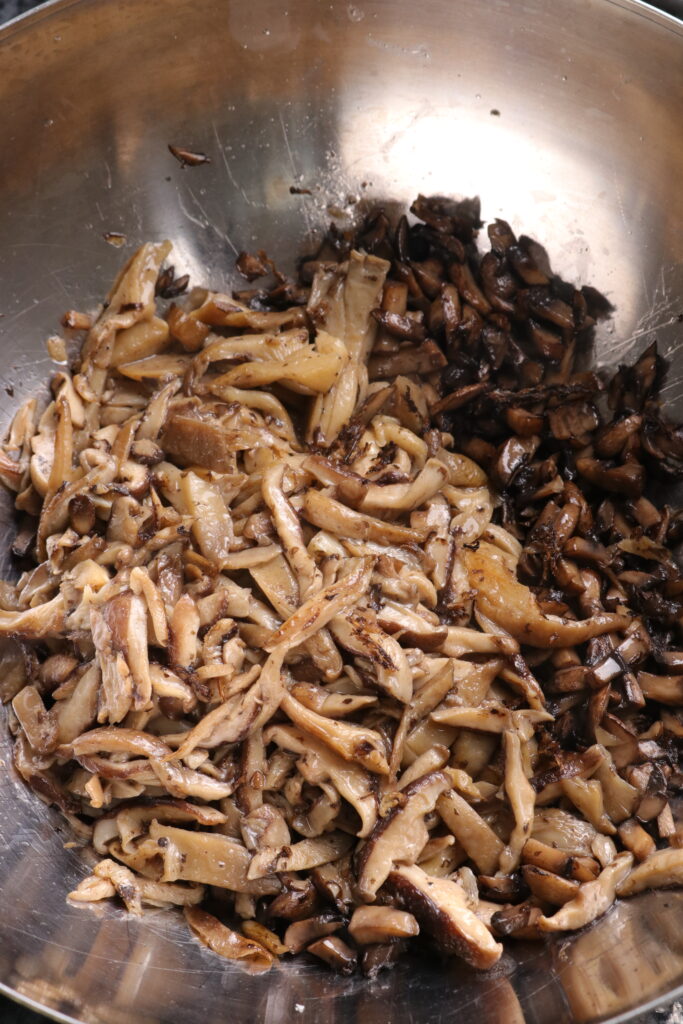 cooked mushrooms in a mixing bowl