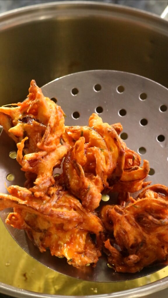 frying crispy onion bhajia