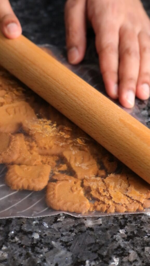 crushing biscoff biscuits with a rolling pin