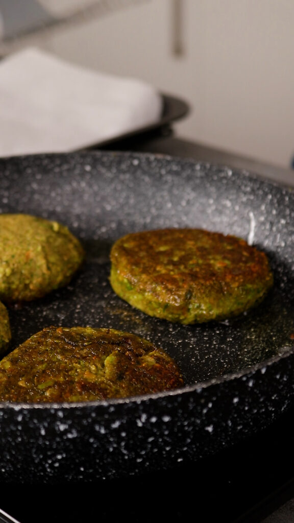 burger patties being pan fried