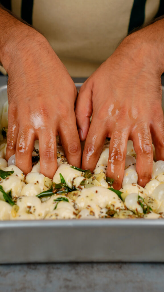 dimpling tadka focaccia dough