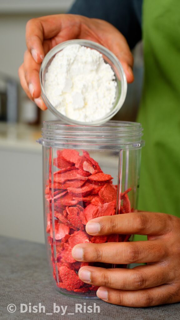 freeze dried strawberries and cornflour in a blender jug