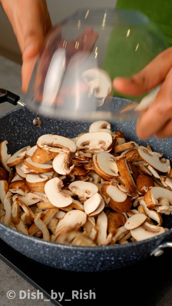 add sliced mushrooms to pan