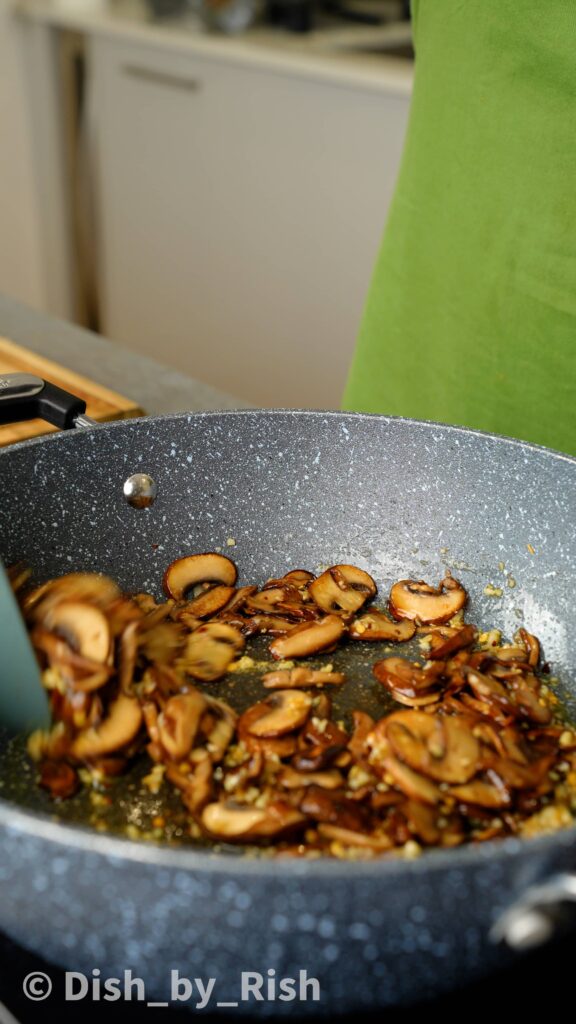 adding caramelised mushrooms to the pan