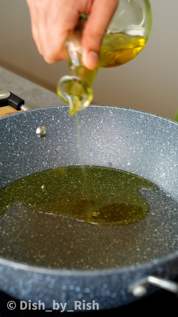 pouring olive oil into a saucepan