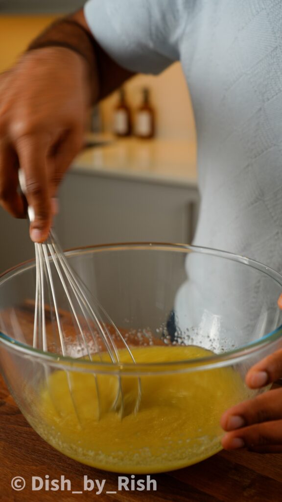 whisking oil sugar and vanilla