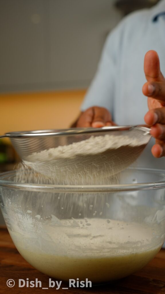 sifting in flour, baking powder, and salt