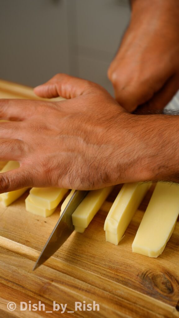 cutting low moisture mozzarella into sticks