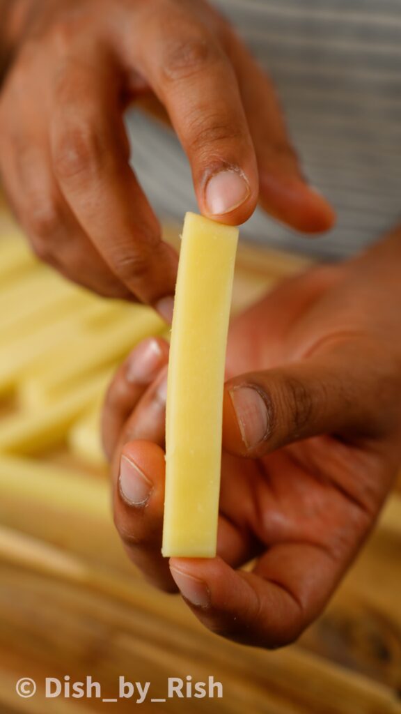 cutting low moisture mozzarella into sticks