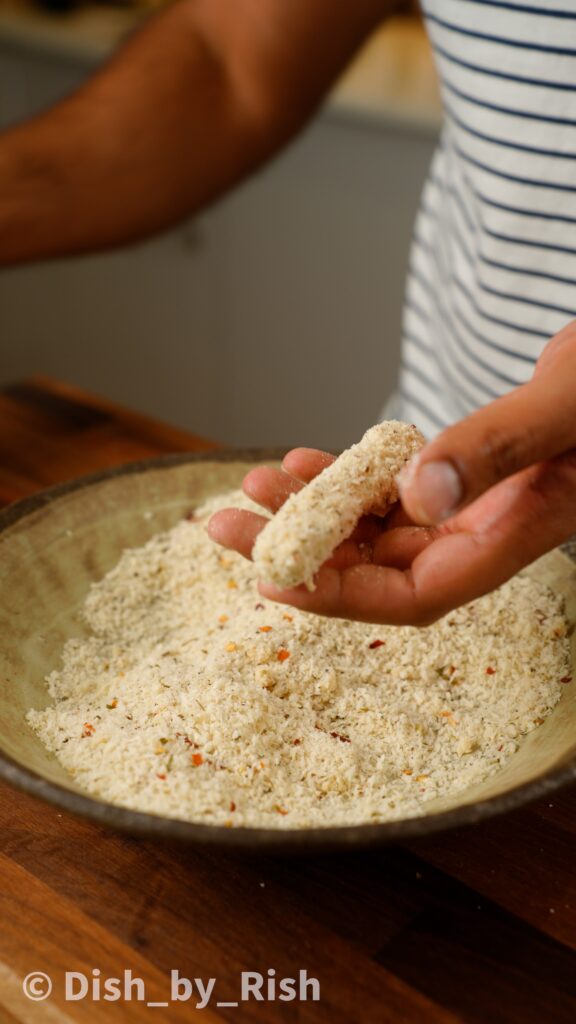 second dunk of mozzarella into panko breadcrumbs