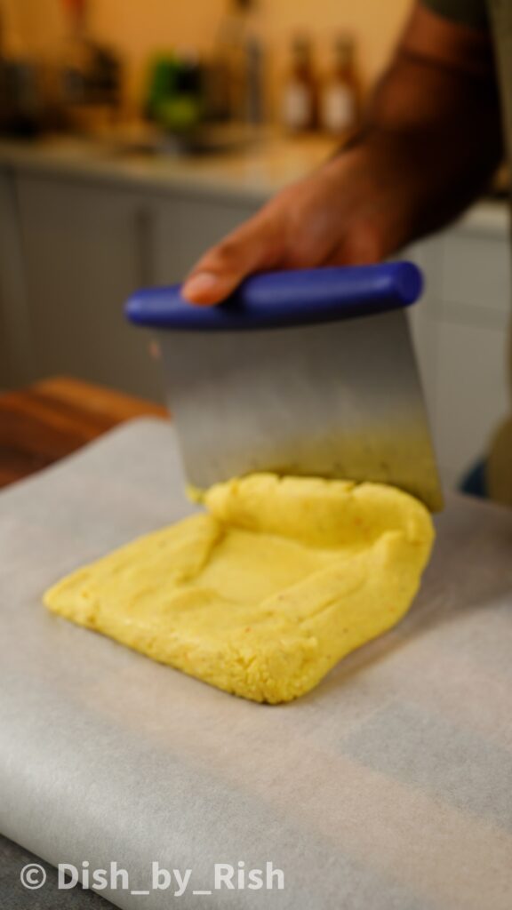 folding edges of barfi over