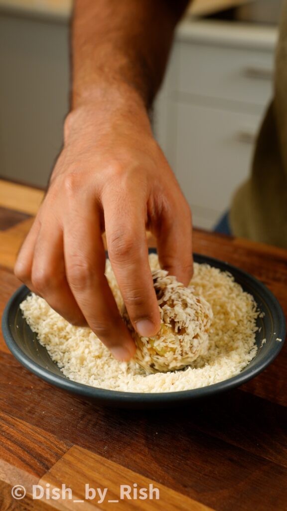 tossing cookie dough in coconut