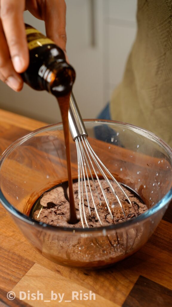 adding vanilla to the bloomed cocoa powder