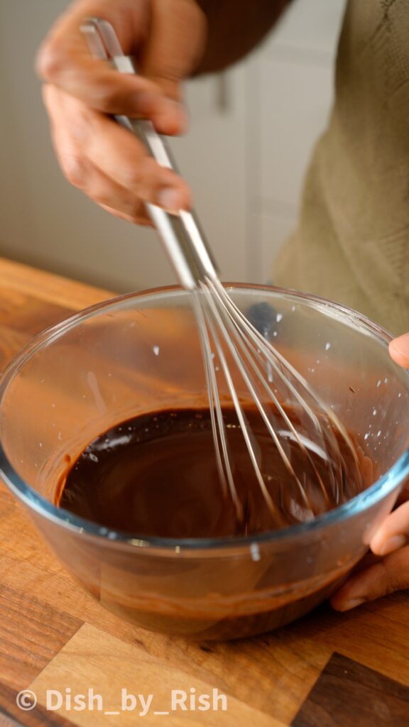 whisking bloomed cocoa mixture