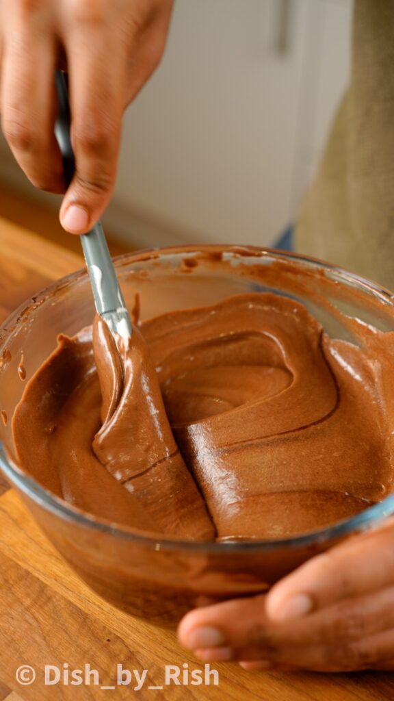 folding egg whites into chocolate yolk mixture