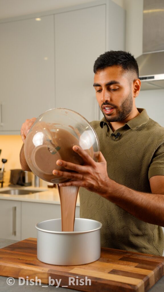 pouring chiffon cake mixture into baking tin