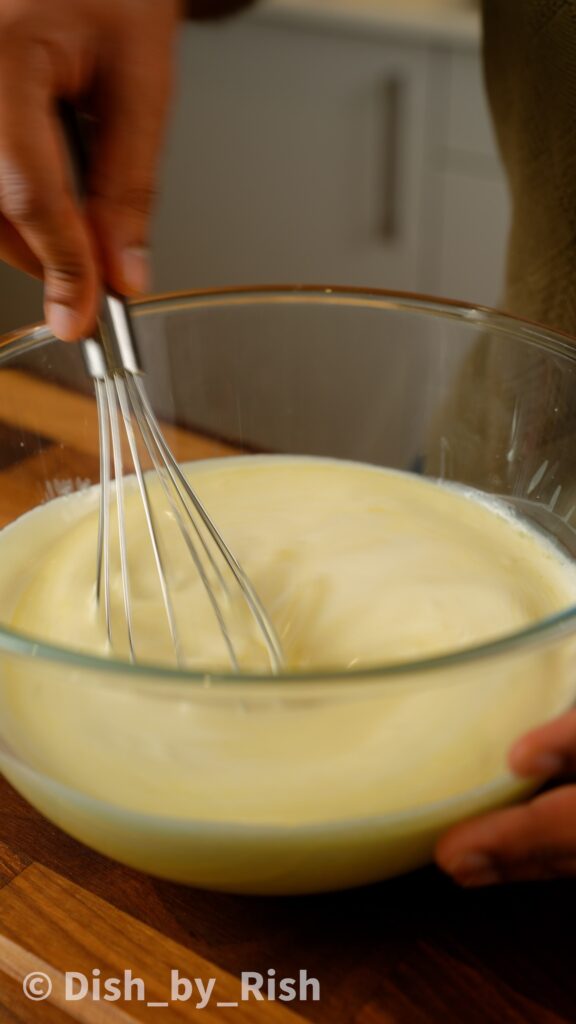 whisking white chocolate and cream