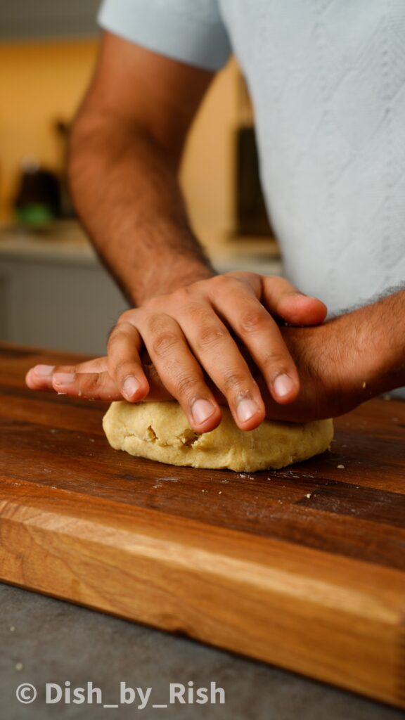 pressing pie dough into a disc