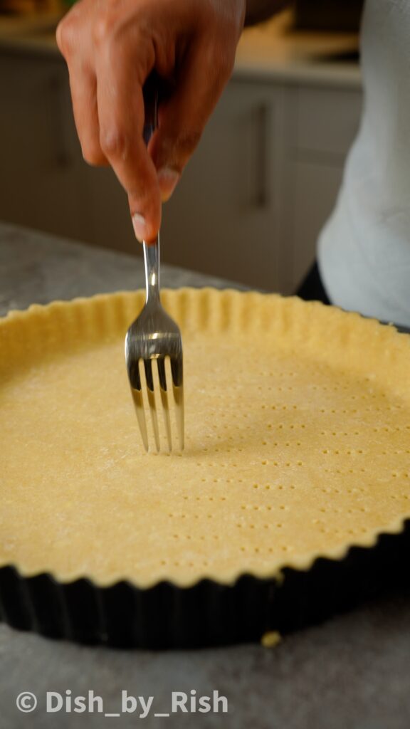 docking base of pastry with a fork