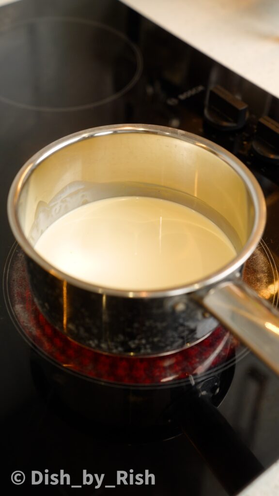 cream and vanilla heating in a saucepan