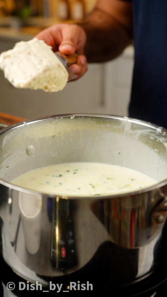 adding truffle cream cheese to béchamel