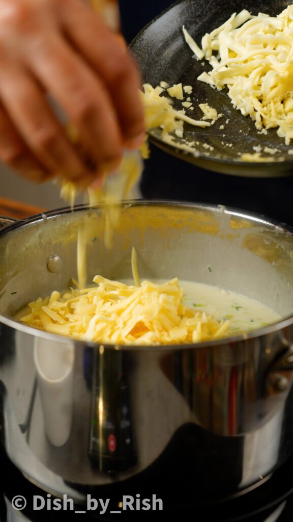 adding cheeses to béchamel