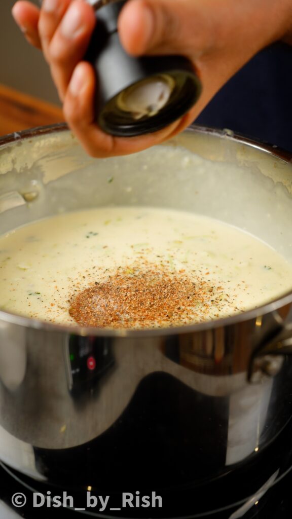 adding seasonings to béchamel