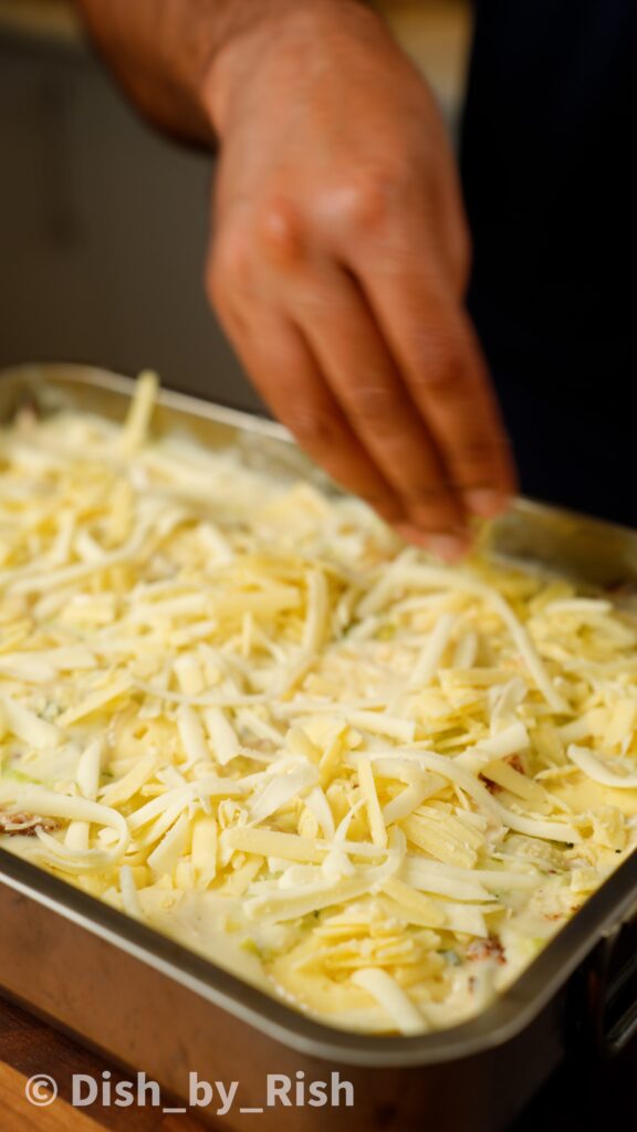 topping truffle and brie cauliflower cheese with cheddar and mozzarella