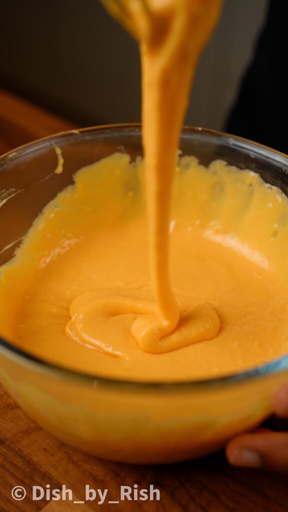 smooth egg yolk mixture whisked with dry ingredients