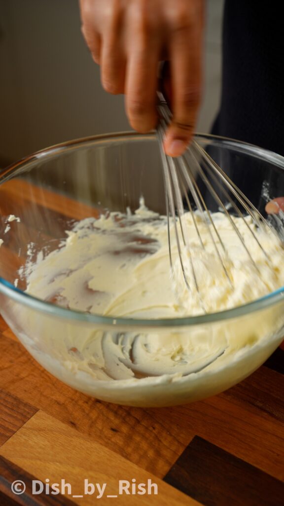 whisking mascarpone with vanilla and sugar