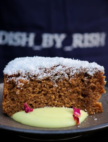 egg free Masala chai cake in a plate with cardamom custard