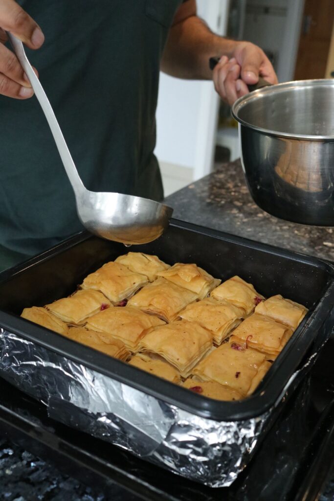 sugar syrup poured over baked coconut and walnut baklava