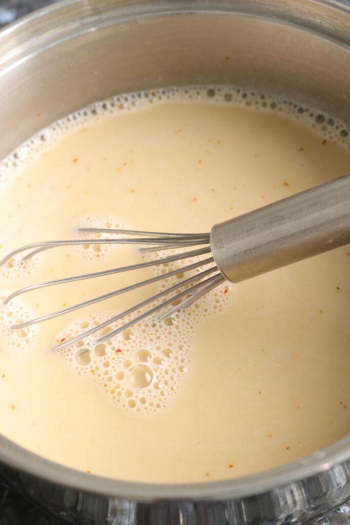 whisk custard ingredients in saucepan