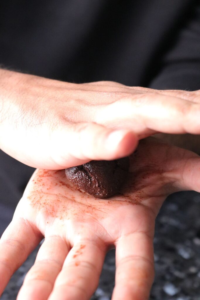 rolling the dark chocolate truffles in palm of hand