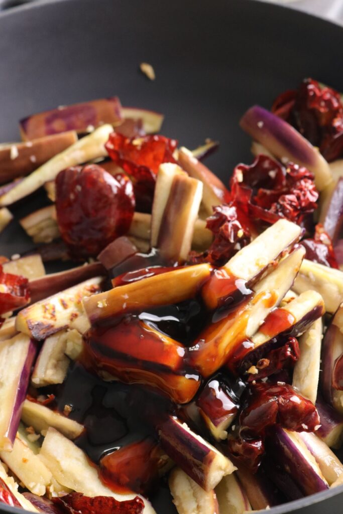 mushroom sauce and light soy sauce added to aubergines