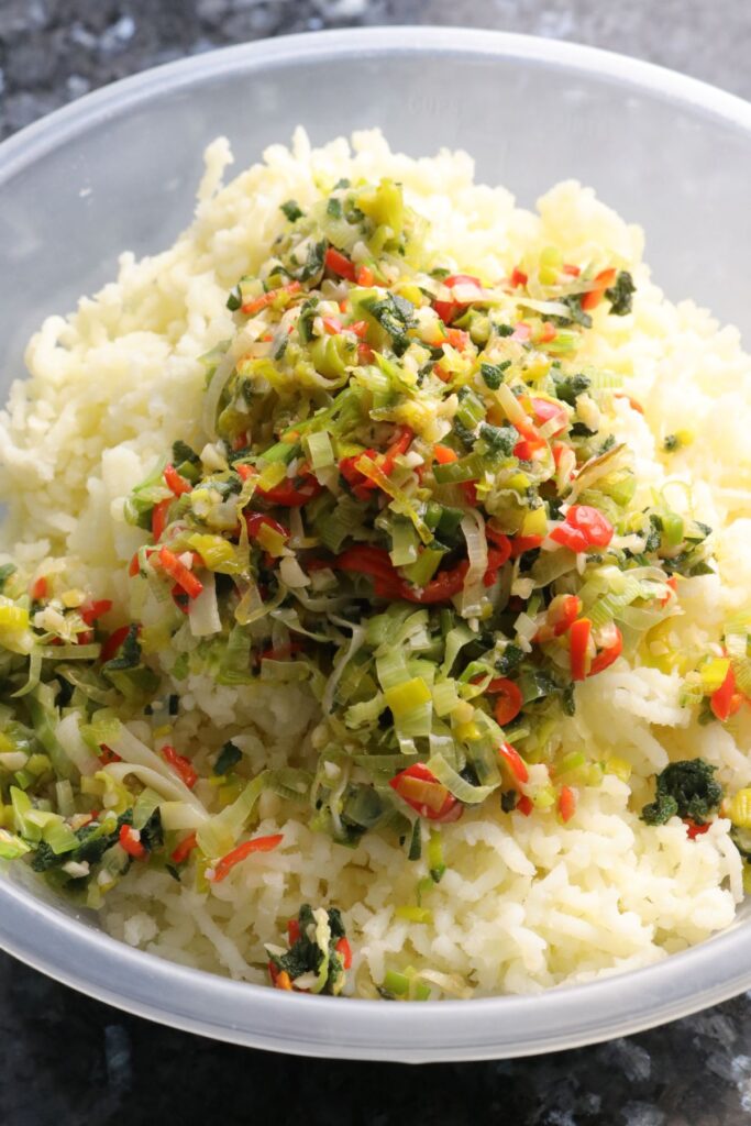 leeks, garlic, red chilli, and sage added to grated potatoes