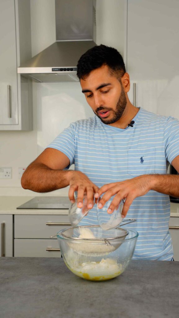 sifting in plain flour and cornflour