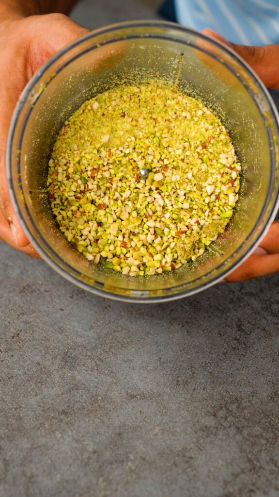 blitz almonds and pistachios in a food processor