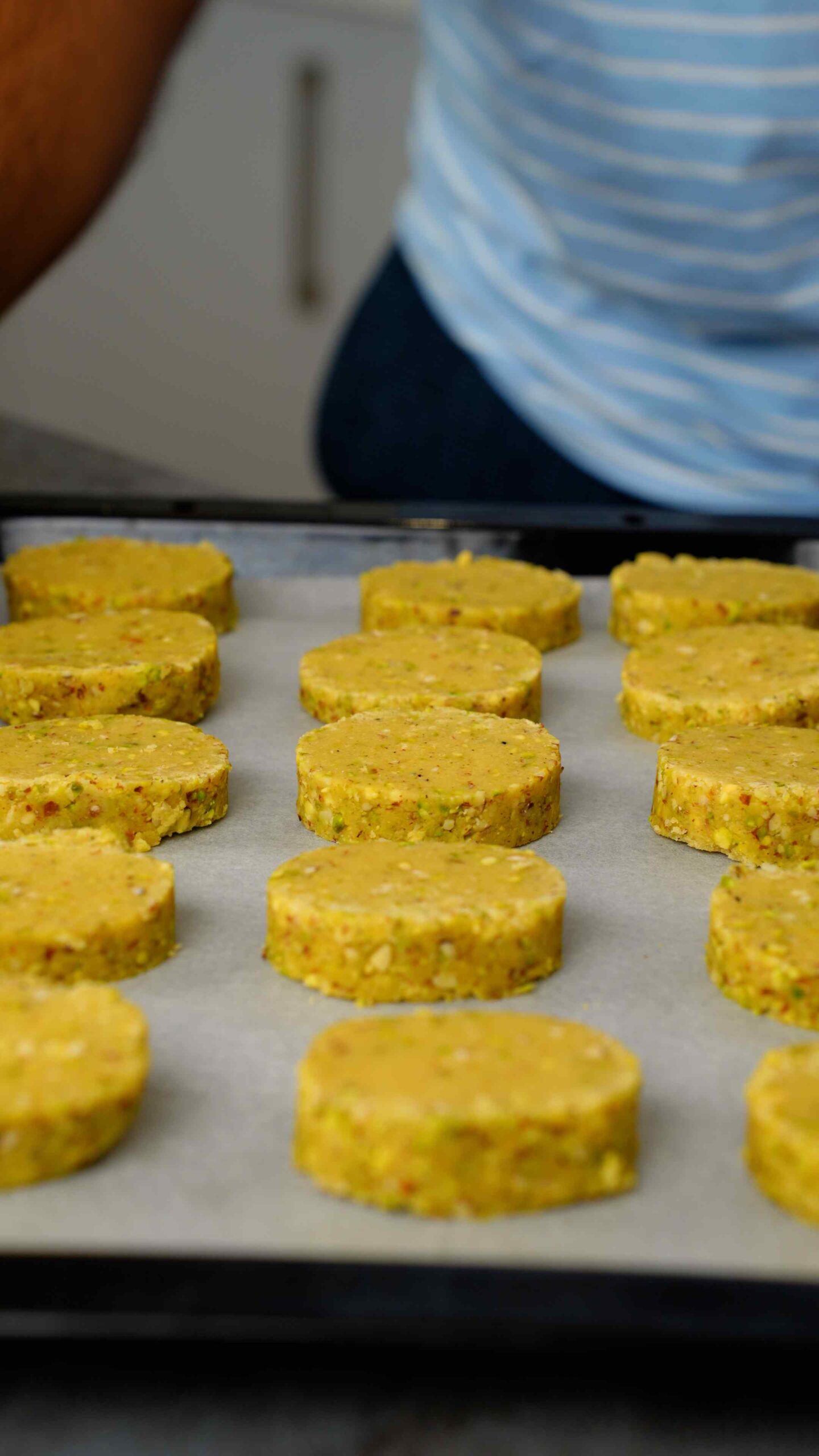 Placing shortbread on to a baking tray