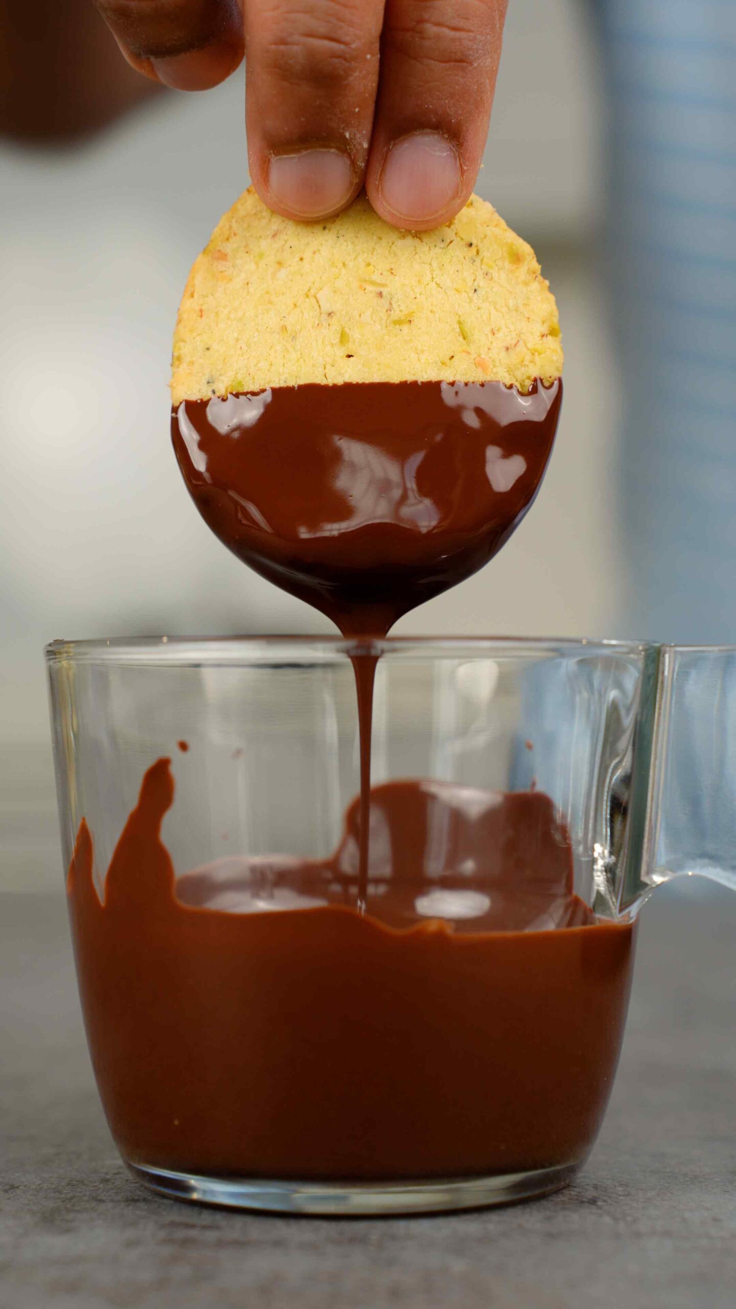 dunking shortbread in melted dark chocolate