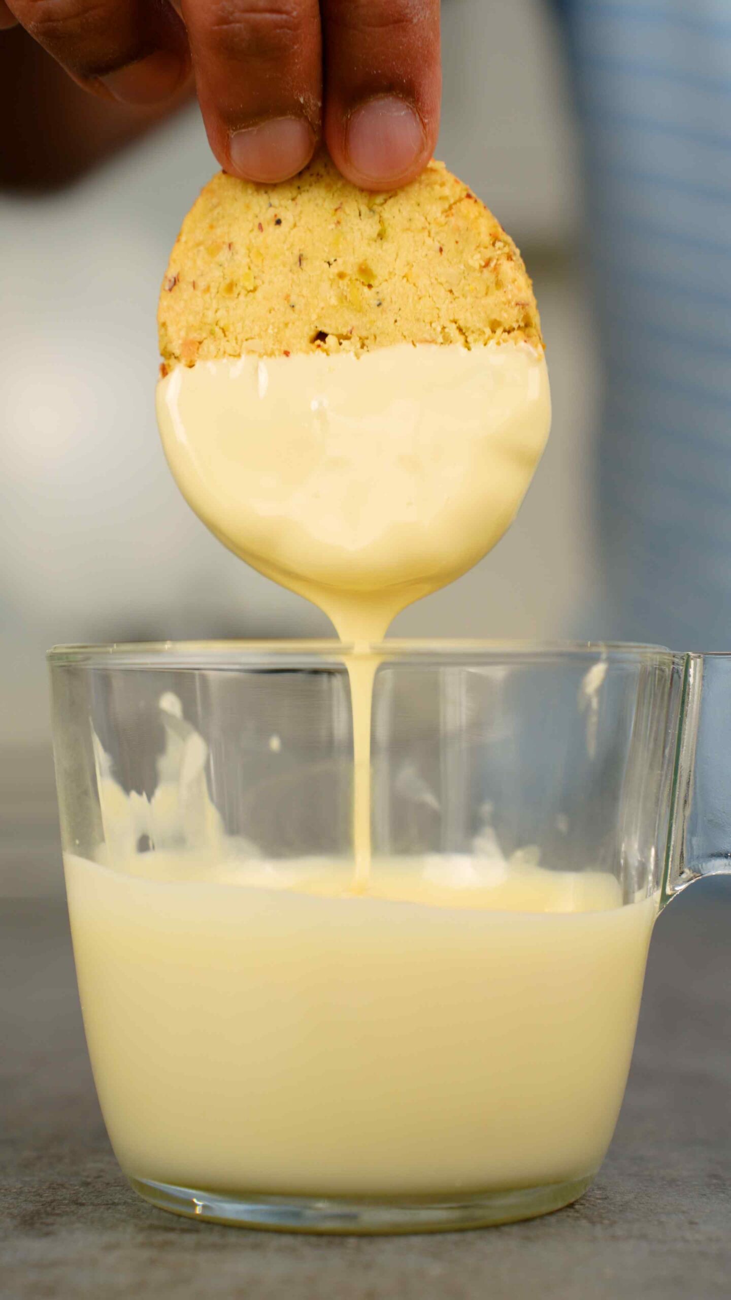 dunking shortbread in melted white chocolate